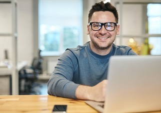 Smiling man working from home